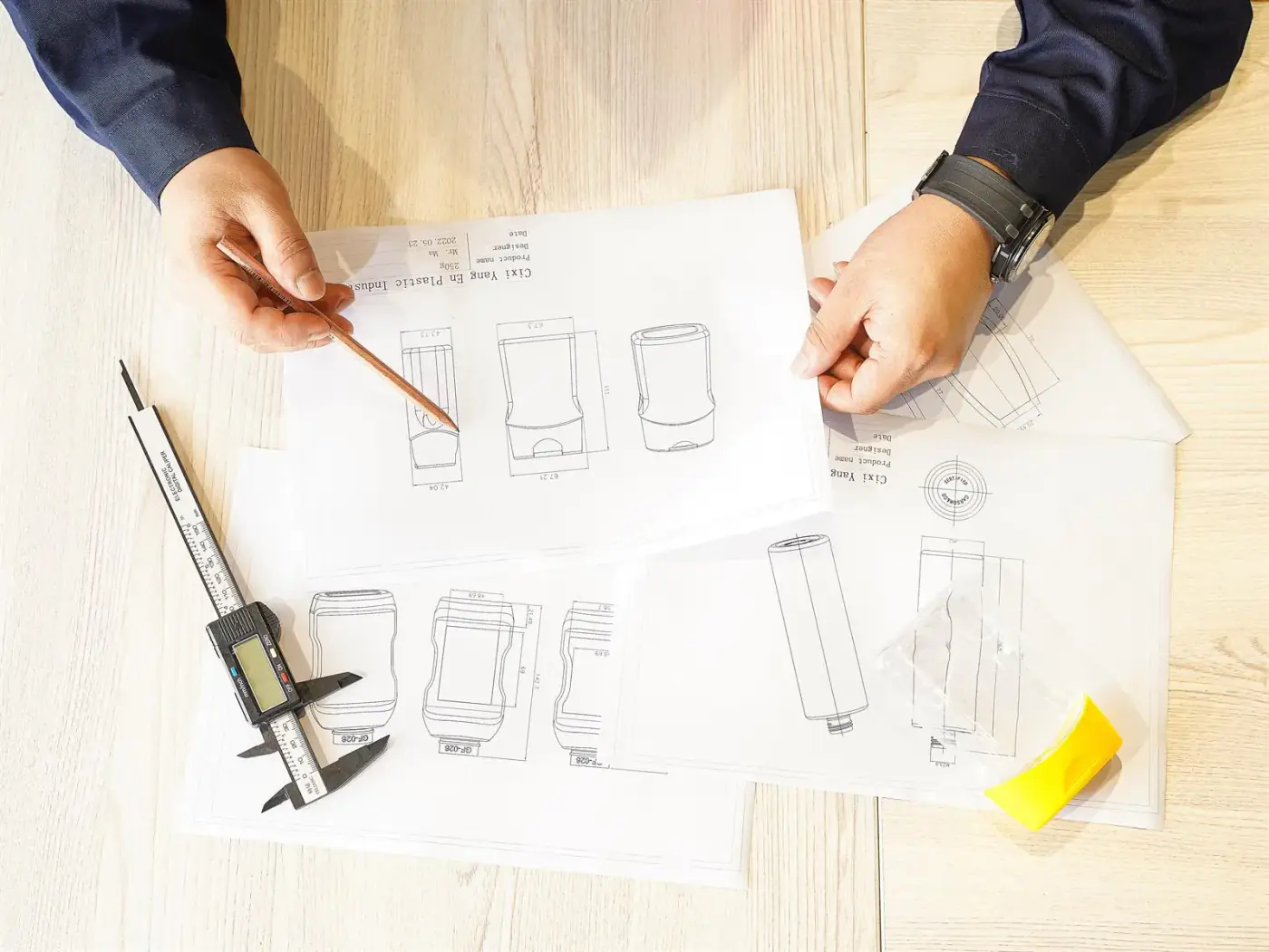 Gracepack engineer reviewing plastic bottle drawings and dimensions for remote process verification