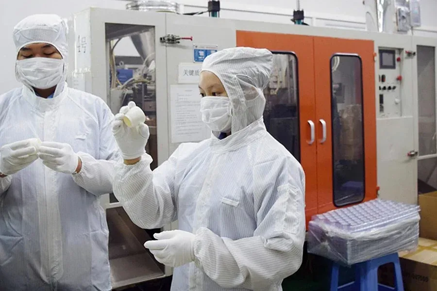 Plastic bottle samples inspected under controlled factory conditions before shipment approval