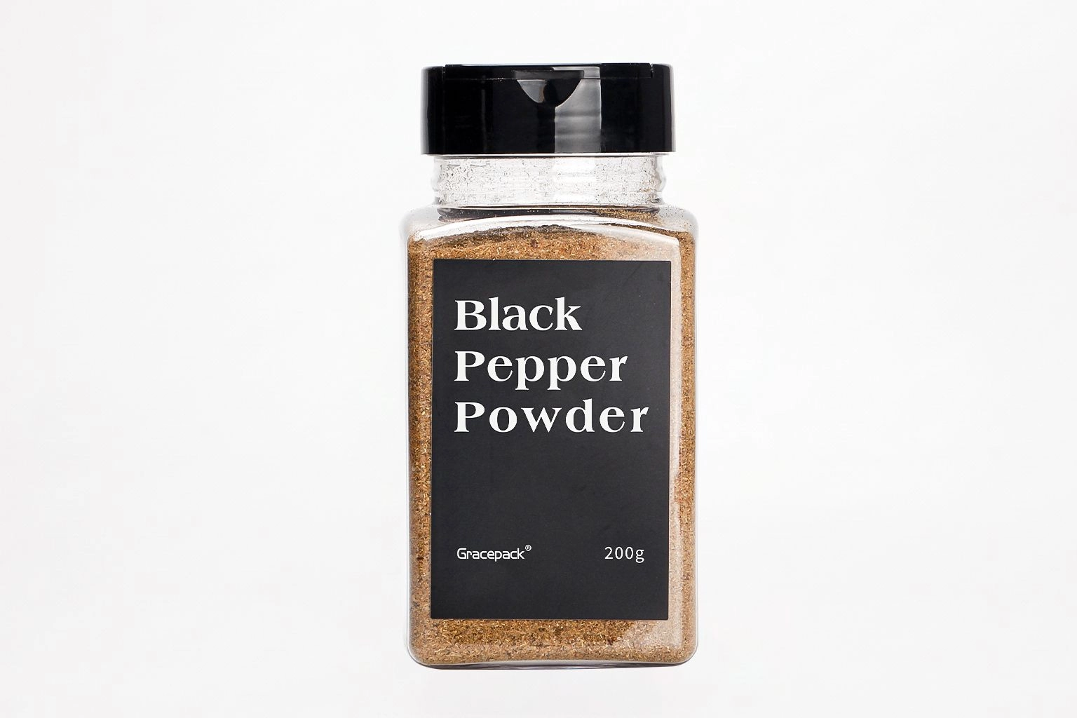 Square clear plastic spice bottle with a black cap and black pepper powder label
